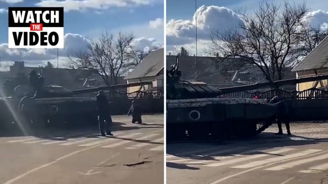 Ukrainian man tries to stop Russian tank with his bare hands