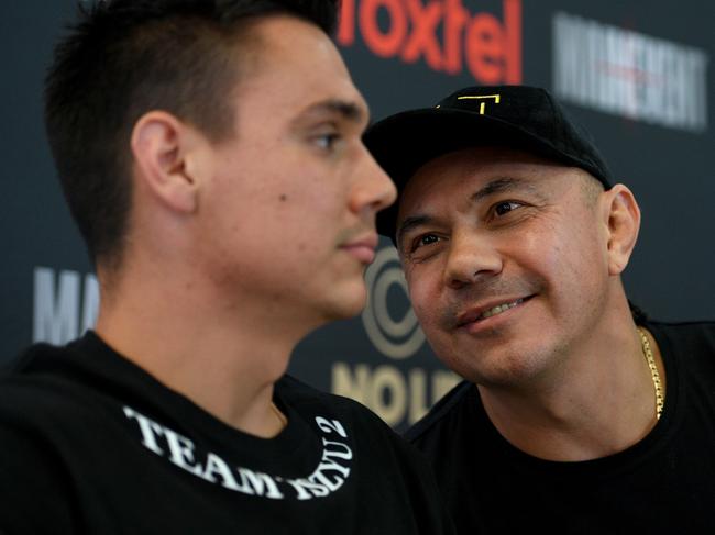 Australian boxing great Kostya Tszyu (right) speaks to his son Tim during an announcement of an upcoming Junior Middleweight bout in Sydney, Thursday, September 26, 2019. Tim Tszyu will fight Jack Brubaker at the Sydney International Convention Centre on December 6. (AAP Image/Dan Himbrechts) NO ARCHIVING