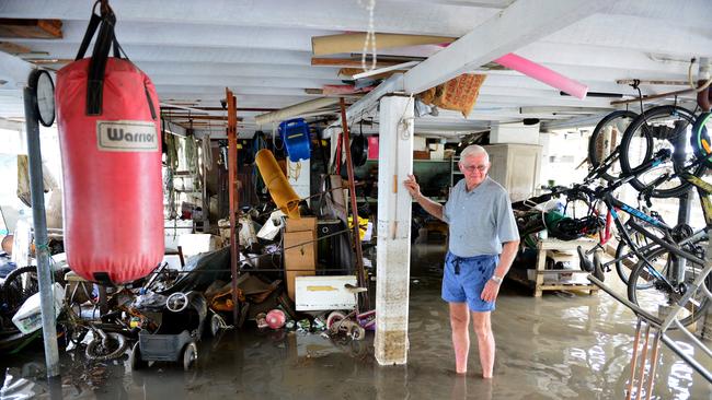 Townsville floods. Aftermath in Hermit Park. Neville Mosch checks the ground level of his home in Whyte Street. Picture: Evan Morgan