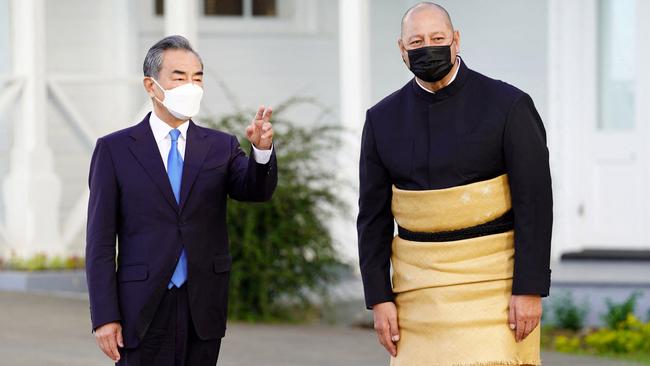 Chinese Foreign Minister Wang Yi, left, with King Tupou VI of Tonga at the Royal Palace in Nukualofa on Tuesday. Picture: AFP