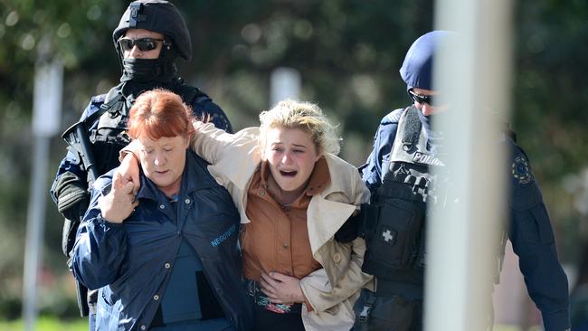 A hostage following the siege at Marilyn’s Studio. Picture: Tom Huntley