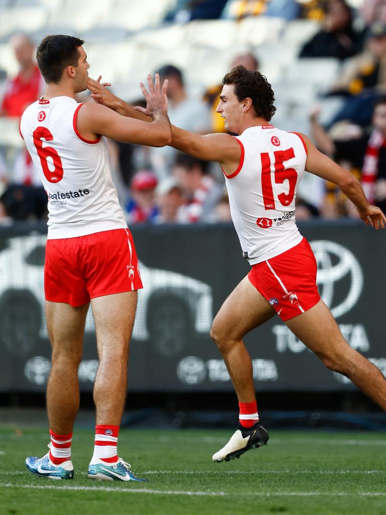 Wicks celebrates his first goal with Logan McDonald. (Photo by Michael Willson/AFL Photos via Getty Images)