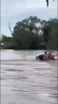 Terrifying moment two men swallowed by floodwaters in Queensland