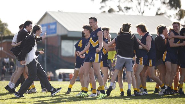 MELBOURNE, AUSTRALIA - AUGUST 03: Lochie Reidy of Whitefriars College (C) and teammates celebrate on the final siren after winning the Herald Sun Shield Senior Boys Grand Final between Whitefriars College and St Patrick's Ballarat at Box Hill City Oval on August 03, 2022 in Melbourne, Australia. Picture: Daniel Pockett/AFL Photos/via Getty Images