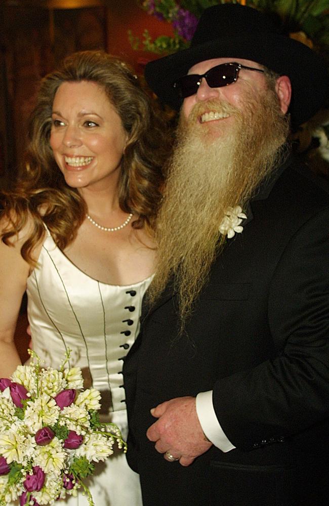 Dusty Hill with his wife Charleen "Chuck" McCrory, following their marriage ceremony in Houston. Picture: AP Photo/ZZ Top, Richard Carson