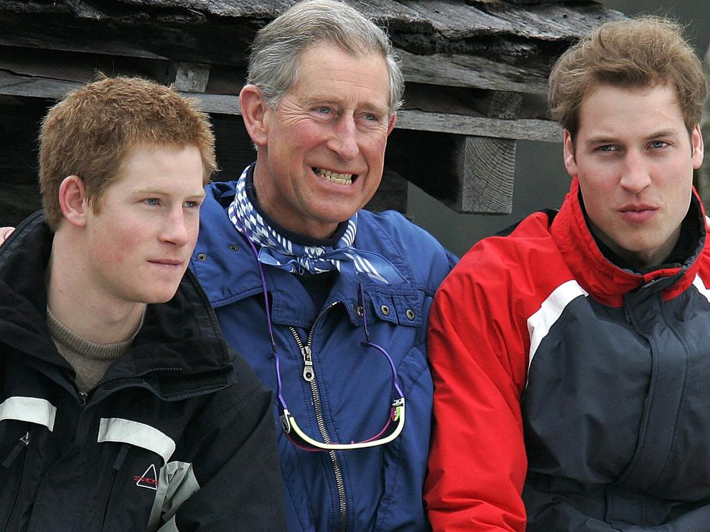 Prince Harry at the age of 21 with his father and brother in 2005. Picture: AP