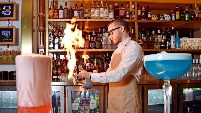 The Governor’s Andrew Ratcliff adds a firey touch to the hotel’s cocktails. Picture: Troy Snook