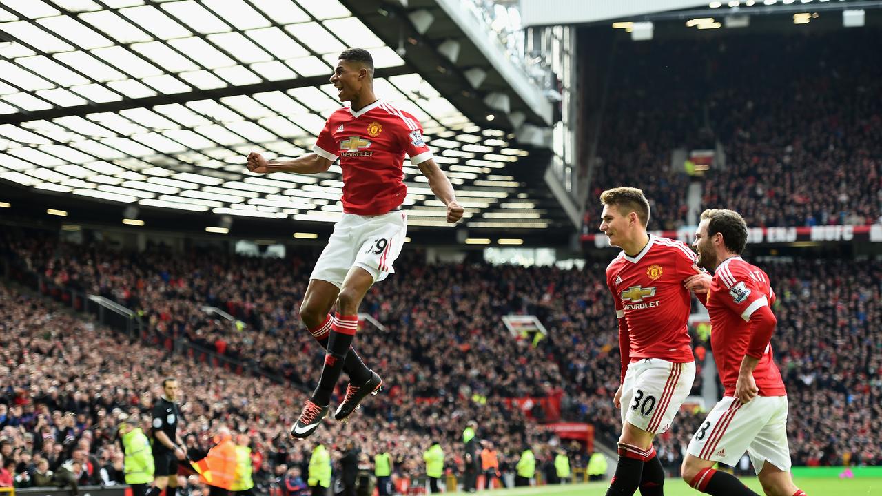 MANCHESTER, ENGLAND - FEBRUARY 28: Marcus Rashford of Manchester United celebrates scoring his opening goal during the Barclays Premier League match between Manchester United and Arsenal at Old Trafford on February 28, 2016 in Manchester, England. (Photo by Laurence Griffiths/Getty Images)