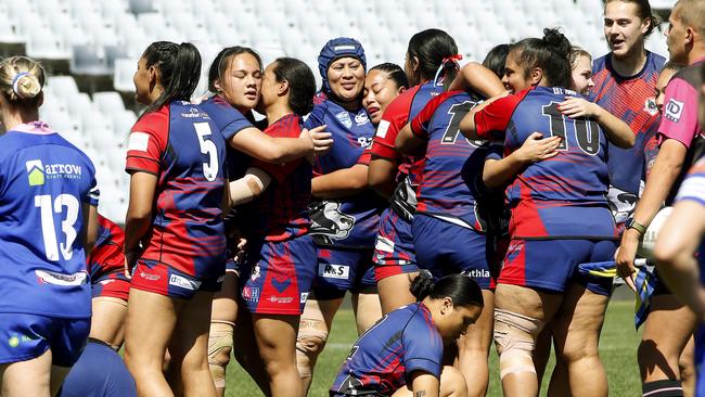 Campbelltown Collegians players celebrate their win at full time. Picture: John Appleyard