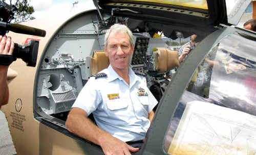 Wing Commander Alan Curr sitting inside an ejected F-111 cockpit at RAAF Base Amberley yesterday. Picture: Zane Jackson