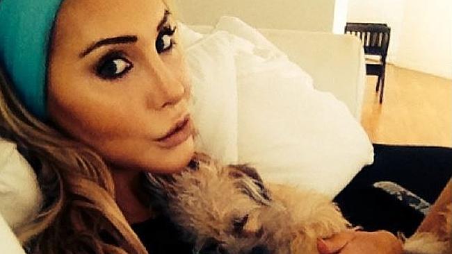 Puppy love...Olivia Newton-John’s daughter Chloe Lattanzi posted a cosy snap of pup Peanu