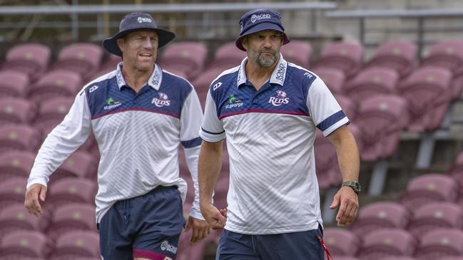 Reds coach Brad Thorn (left) with defence coach Peter Ryan. Picture: Brendan Hertel/QRU