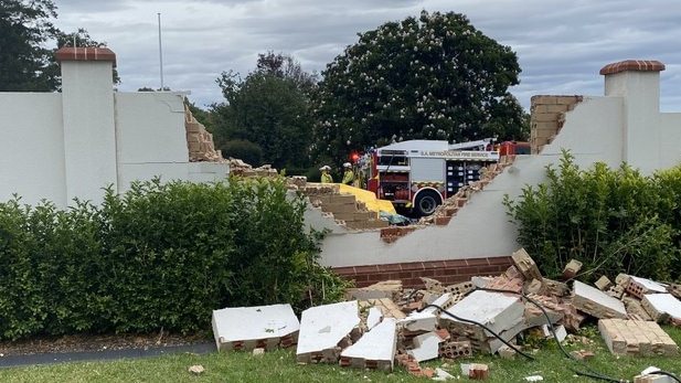 A brick fence was demolished after a car, one of three vehicles in a serious three-vehicle crash at Urrbrae, ploughed through it on Saturday afternoon. Photo: Dixie Sulda/The Advertiser.