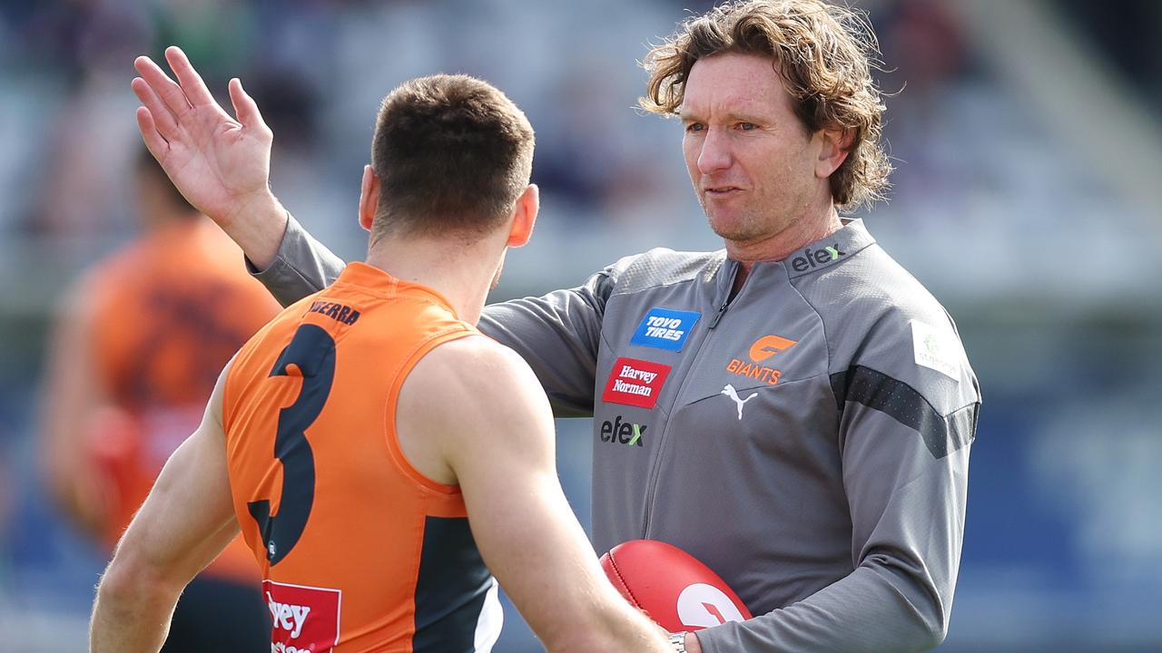 James Hird chats to Giants co-captain Stephen Coniglio.