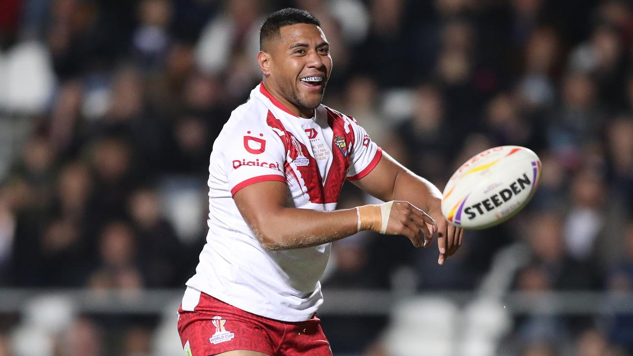 Tonga's Will Penisini scores a try during the Rugby League World