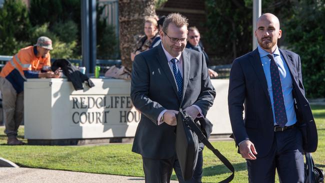 Adam Brooks arrives at Redcliffe Magistrates court with his lawyer. Picture: Brad Fleet