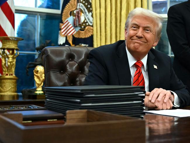 US President Donald Trump smiles after signing an executive order in the Oval Office of the White House in Washington, DC. Picture: AFP