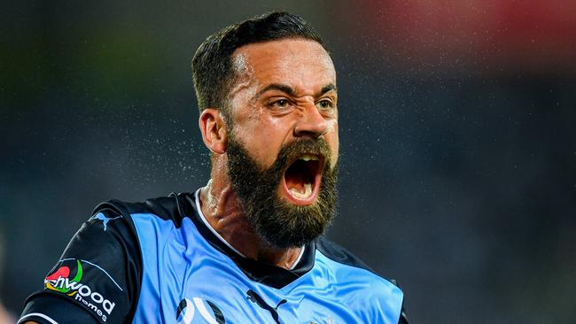 Sydney FC captain Alex Brosque celebrates scoring against Western Sydney Wanderers on Saturday night.