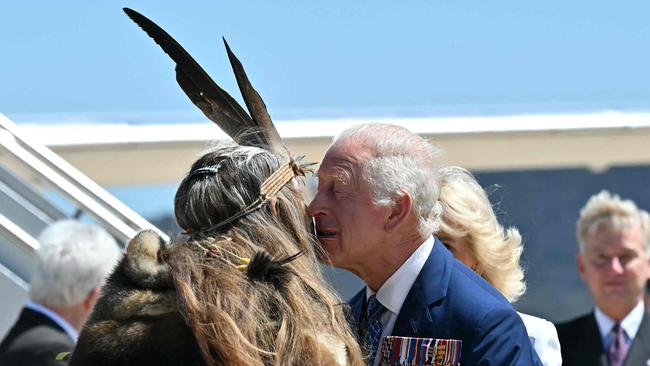 Surprise kiss for King as royals charm Canberra