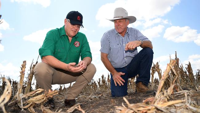 Australian Prime Minister Scott Morrison inspects the dry soil on David Gooding’s drought-affected property near Dalby, Queensland. Picture: AAP/Dan Peled