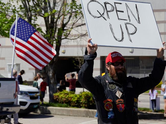 Protesters from a grassroots organization called “REOPEN NC” demonstrate against the North Carolina coronavirus lockdown at a parking lot adjacent to the North Carolina State Legislature in Raleigh, North Carolina, on April 14, 2020. - The group was demanding the state economy be opened up no later than April 29. (Photo by Logan Cyrus / AFP)