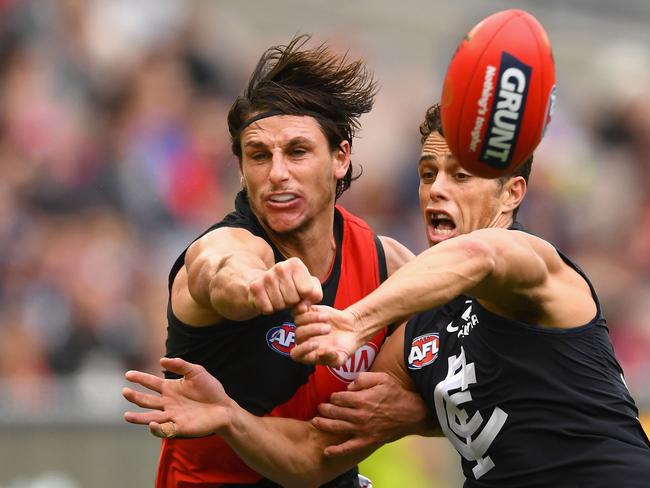 Mark Baguley of the Bombers and Ed Curnow of the Blues compete for a mark during the round eight AFL match between Carlton and Essendon at the MCG on May 12, 2018. Picture: Quinn Rooney