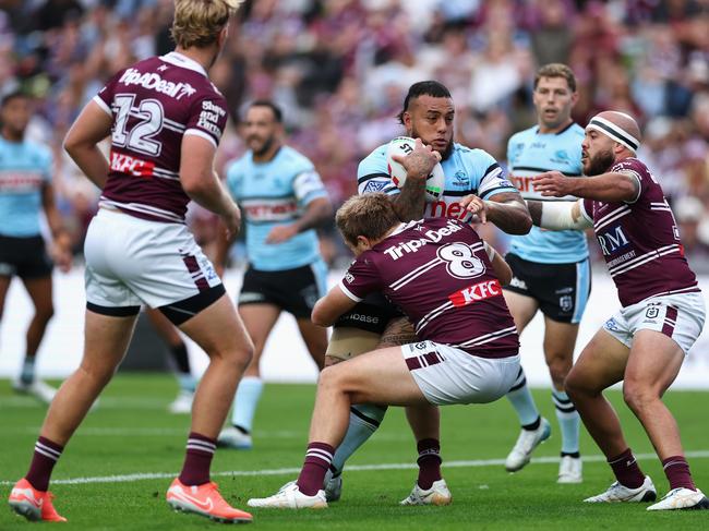 SYDNEY, AUSTRALIA - MAY 11: Addin Fonua-Blake of the Sharks is tackled during the round 10 NRL match between Manly Sea Eagles and Cronulla Sharks at 4 Pines Park, on May 11, 2025, in Sydney, Australia. (Photo by Cameron Spencer/Getty Images)