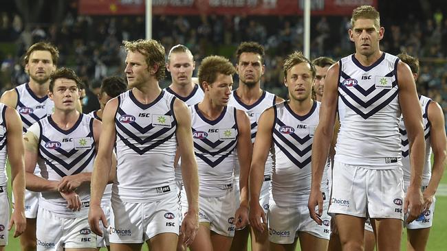 Dejected Fremantle players after the loss to Port Adelaide.