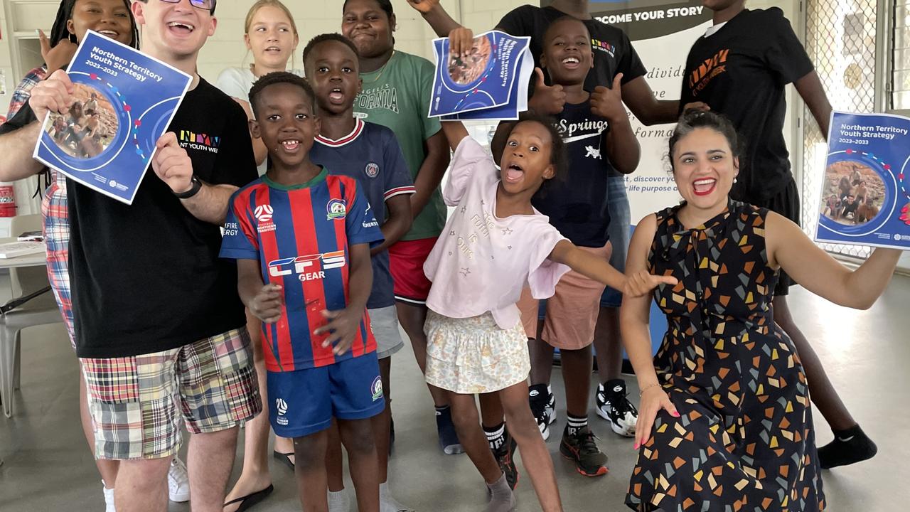 Project Reference Group co-chair Jordan Humphreys, front left, and Youth Minister Lauren Moss, front right, celebrate the launch of the NT Youth Strategy with youth from the Malak Community Centre. Photo: supplied