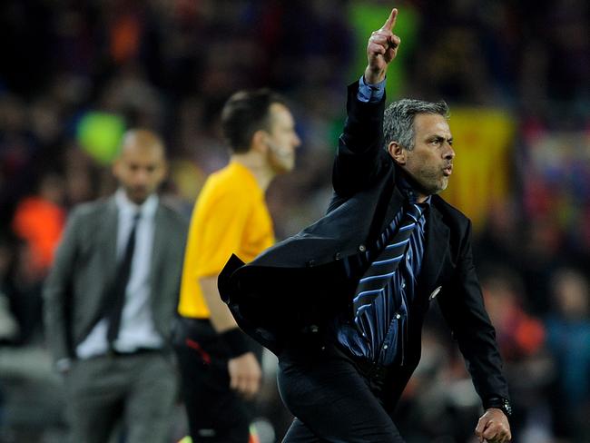 BARCELONA, SPAIN - APRIL 28: Inter Milan manager Jose Mourinho celebrates victory as barcelona manager Josep Guardiola looks on during the UEFA Champions League Semi Final Second Leg match between Barcelona and Inter Milan at Camp Nou on April 28, 2010 in Barcelona, Spain. (Photo by Michael Regan/Getty Images)