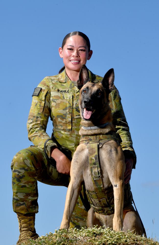 Different elements of 27 Squadron at RAAF Base Townsville ready for Exercise Crimson Dawn. Leading Aircraftwomen Renee Cahil with RAAF working dog Dejzr. Picture: Evan Morgan