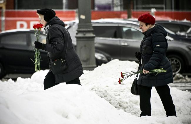 Dozens of people left floral tributes to leate Russian opposition leader at Moscow's 'Wall of Grief' monument to the victims of political repression