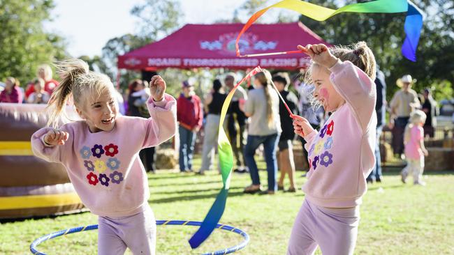 Sadie’s friends, Madison (left) and Lexi Wilkinson at Sadie's Day Out, a special community event to celebrate the life of five-year-old crash victim Sadie, held at Cambooya State School, Saturday, June 7, 2025. Picture: Kevin Farmer