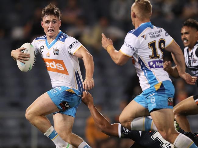 SYDNEY, AUSTRALIA - MAY 08: AJ Brimson of the Titans makes a break during the round nine NRL match between the Wests Tigers and the Gold Coast Titans at Campbelltown Sports Stadium, on May 08, 2021, in Sydney, Australia. (Photo by Matt King/Getty Images)