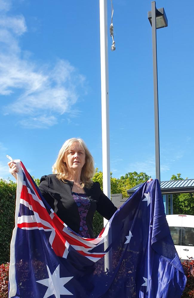 Brisbane City Councillor Angela Owen (Calamvale ward) with a new flag.