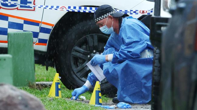 Forensic police officers on scene Sunday morning. Picture: Lachie Millard