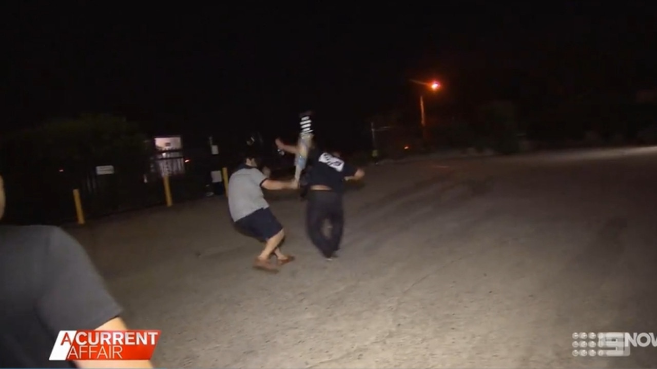 Richard strikes an unnamed member of the ACA crew with a cricket bat. Picture: A Current Affair/Channel 9