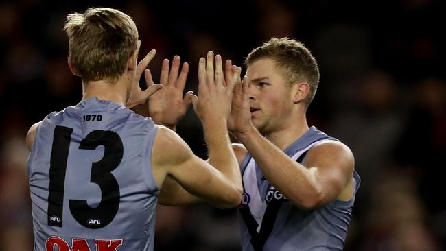 Dan Houston of the Power celebrates a goal with Todd Marshall. Picture: AAP Image/Mark Dadswell