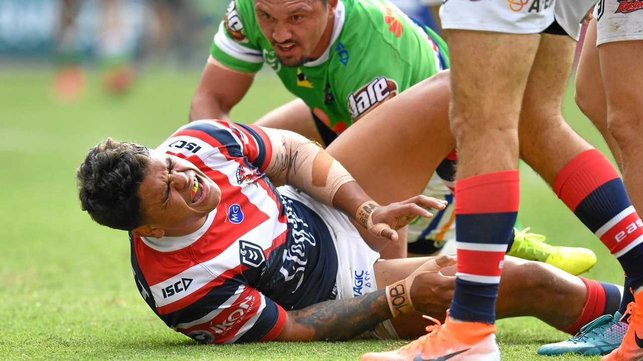 Latrell Mitchell of the Roosters is seen reacting after suffering an injury after scoring a try during the Round 9 NRL match between the Sydney Roosters and the Canberra Raiders at Suncorp Stadium in Brisbane, Sunday, May 12, 2019.  (AAP Image/Darren England) NO ARCHIVING, EDITORIAL USE ONLY. Picture: DARREN ENGLAND