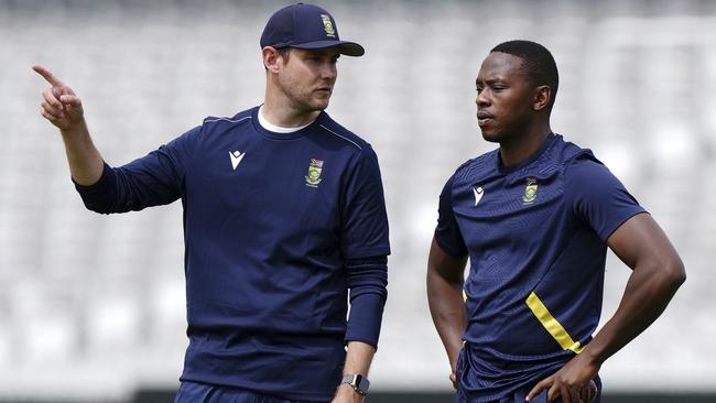 South Africa coach Stuart Broad speaks to Kagiso Rabada, right, during a nets session at Lord's, London, Monday June 9, 2025. (Ben Whitley/PA via AP)