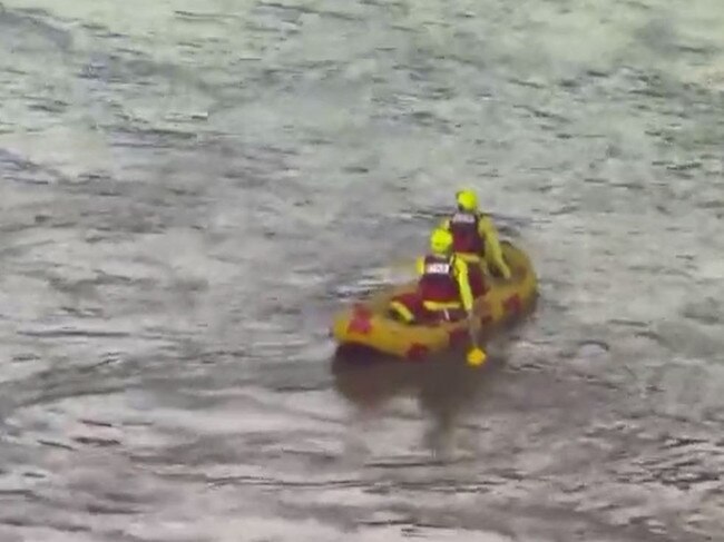 Fire Fighters searching for a man who reportedly went missing in the Brisbane river. Picture: 7News.