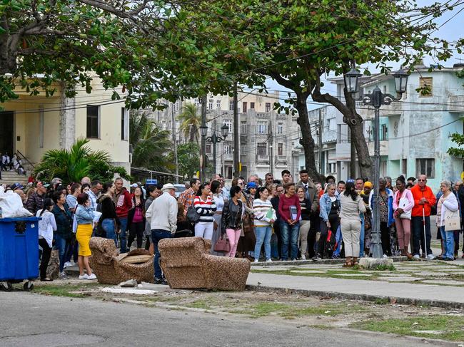 Cubans wait to enter the U.S. Embassy to apply for a visa in Havana on January 15, 2025. Outgoing US President Joe Biden on Tuesday decided to remove Cuba from the list of countries that sponsor terrorism in order to encourage the release of a âsignificantâ number of political prisoners, a decision applauded by Havana. (Photo by ADALBERTO ROQUE / AFP)