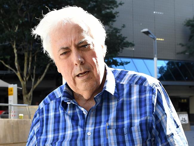 Businessman and former federal MP Clive Palmer arrives holding a sick-bag to the Federal Court in Brisbane, Tuesday, May 16, 2017. Mr Palmer appeared at the court  to face further questioning  by the liquidators of the collapsed Queensland Nickel company.  (AAP Image/Dave Hunt) NO ARCHIVING