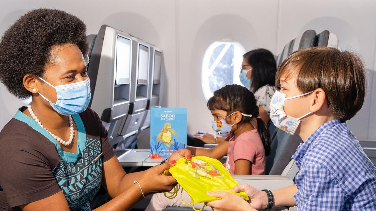 Kids receiving their activity pack. Picture: Fiji Airways