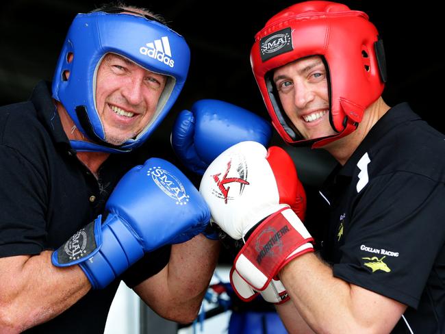 Brisbane racehorse trainers Robert Heathcote and Tony Gollan fight it out in the boxing ring. Pic Darren England.