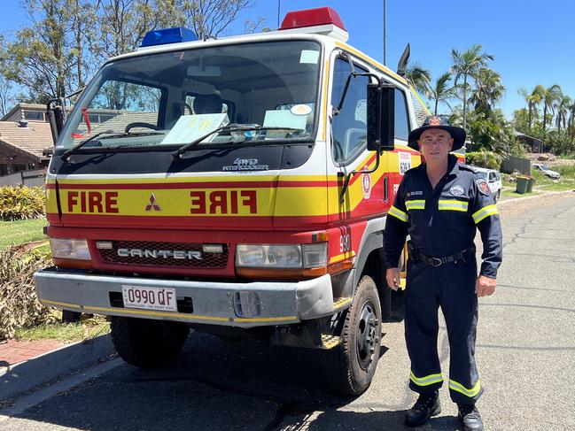 Queensland Fire and Rescue Service officer Dale McVeigh as firies check on damage to homes on Tamworth Drive in Helensvale. Picture: Keith Woods.