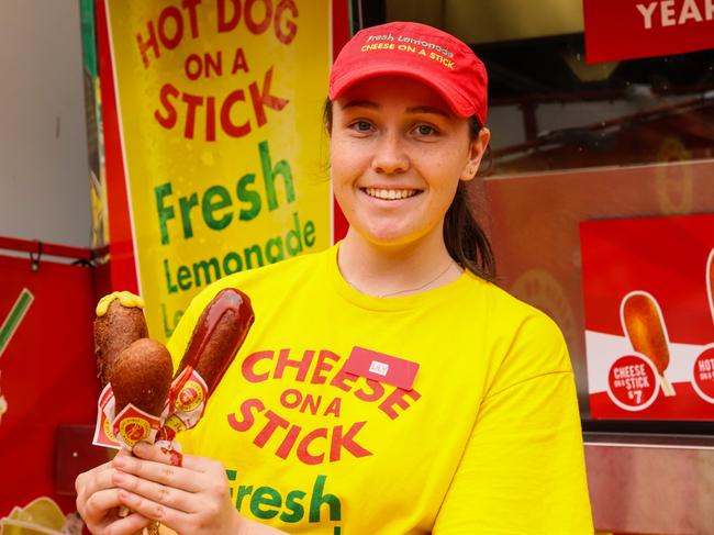 Lily Carr holds a Hot Dog on a Stick and Cheese on a Stick. Picture: Jenifer Jagielski