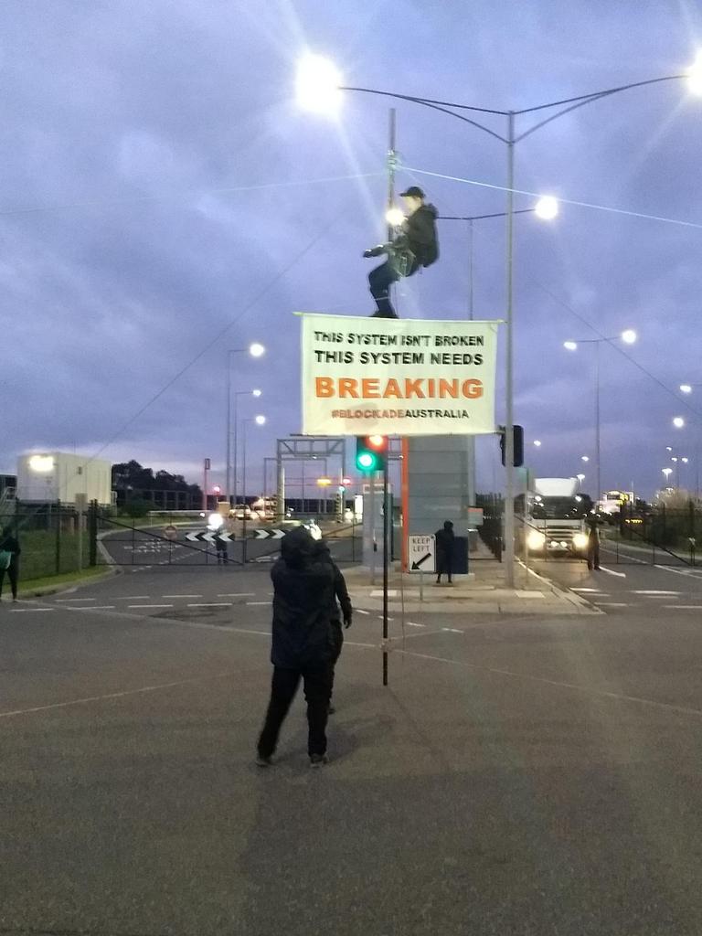 A 26-year-old man blocks an entrance to the Port of Melbourne on Tuesday. Picture: Facebook