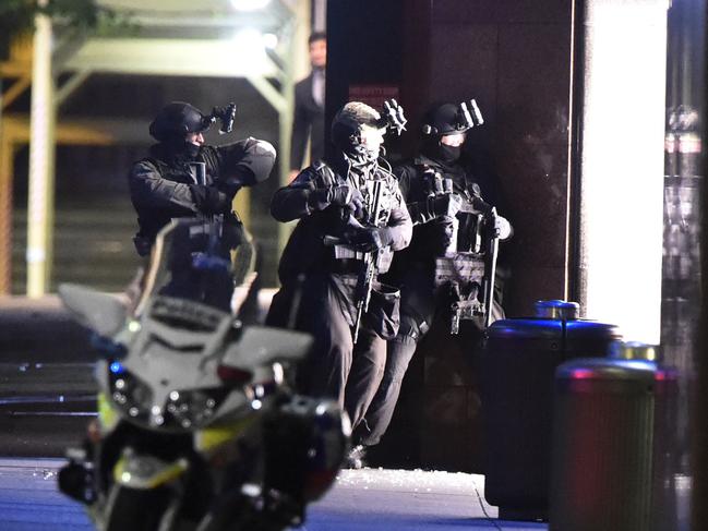 TOU officers storming the Lindt Cafe at 2:14am. Picture: Gordon McComiskie