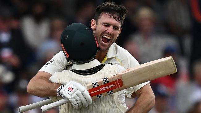 Australia's Mitchell Marsh celebrates with Australia's Travis Head after reaching his century on day one of the third Ashes Test match at Headingley. Picture: AFP